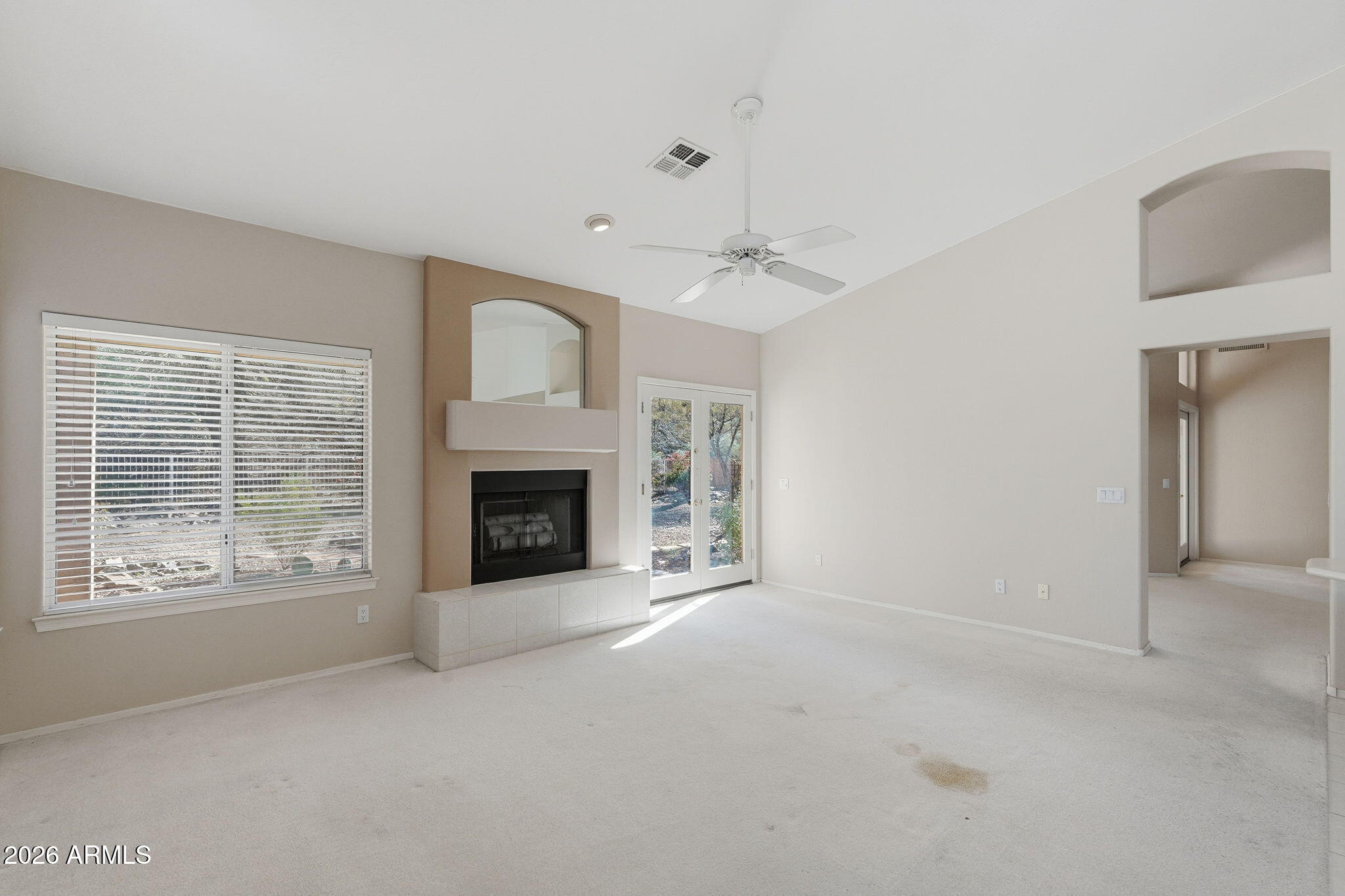 16651 South 18th Way Phoenix, AZ 85048 - Photo 10 of 43 a view of a livingroom with an empty space and a fireplace