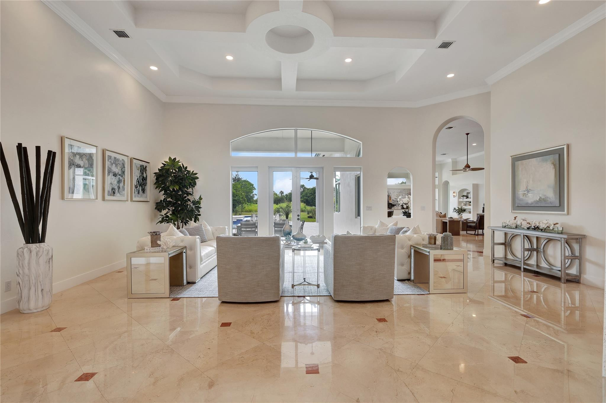 Undisclosed Address Southwest Ranches, FL 33332 - Photo 13 of 54 a living room with furniture a large window and a chandelier