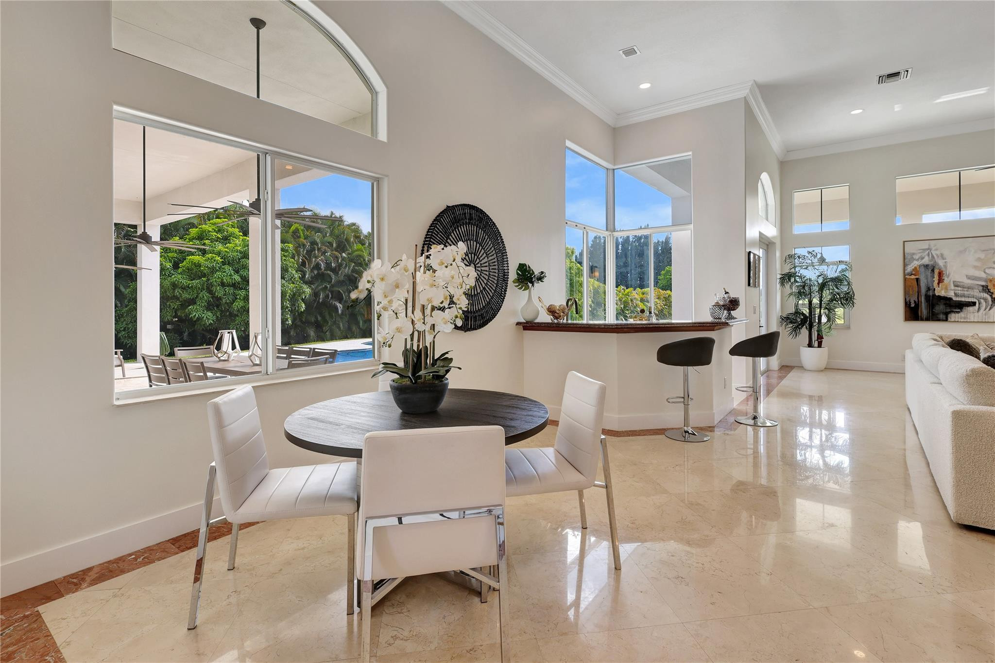 Undisclosed Address Southwest Ranches, FL 33332 - Photo 16 of 54 a view of a dining room with furniture a livingroom and chandelier
