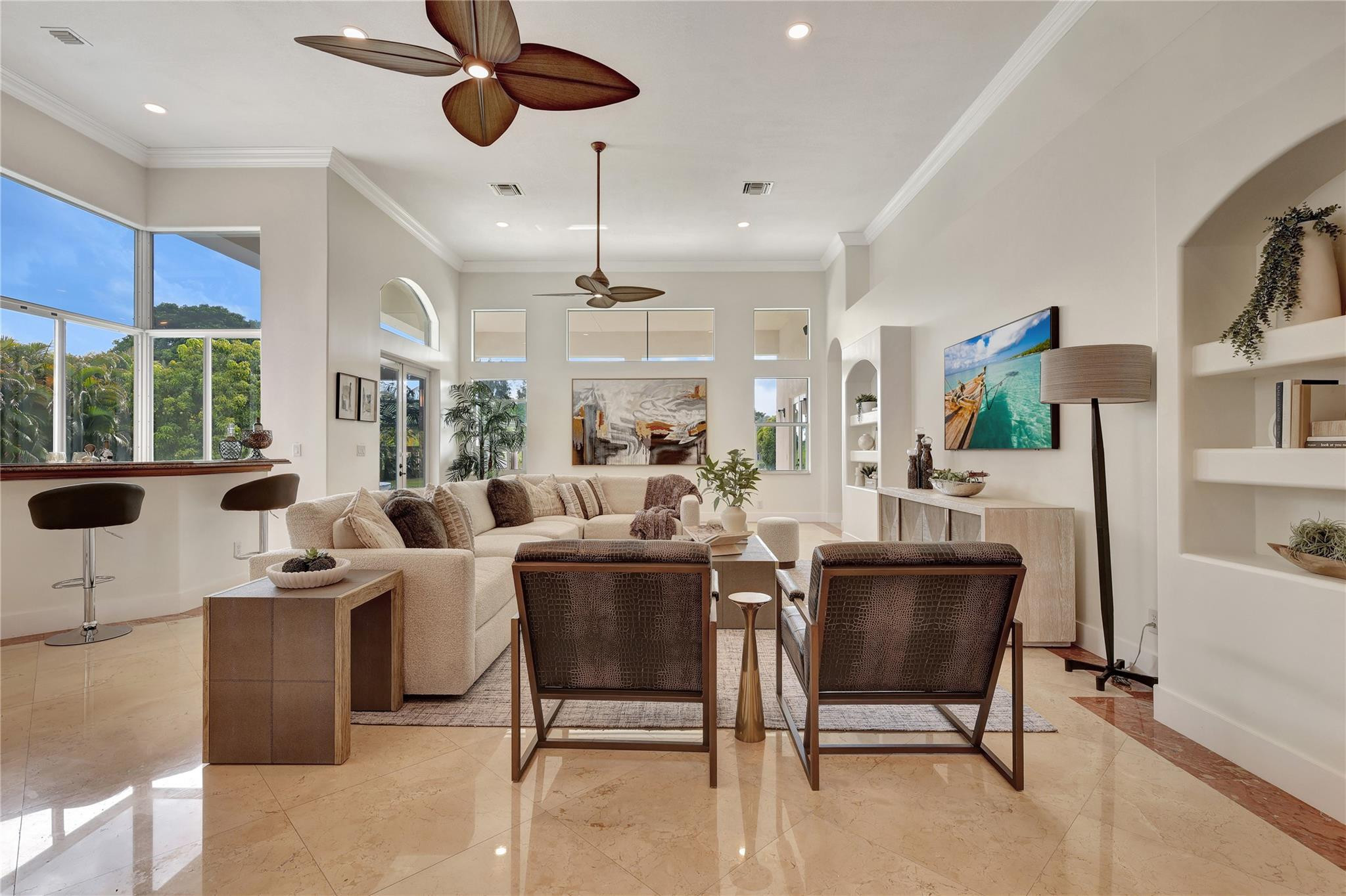 Undisclosed Address Southwest Ranches, FL 33332 - Photo 20 of 54 a living room with furniture a chandelier and a floor to ceiling window