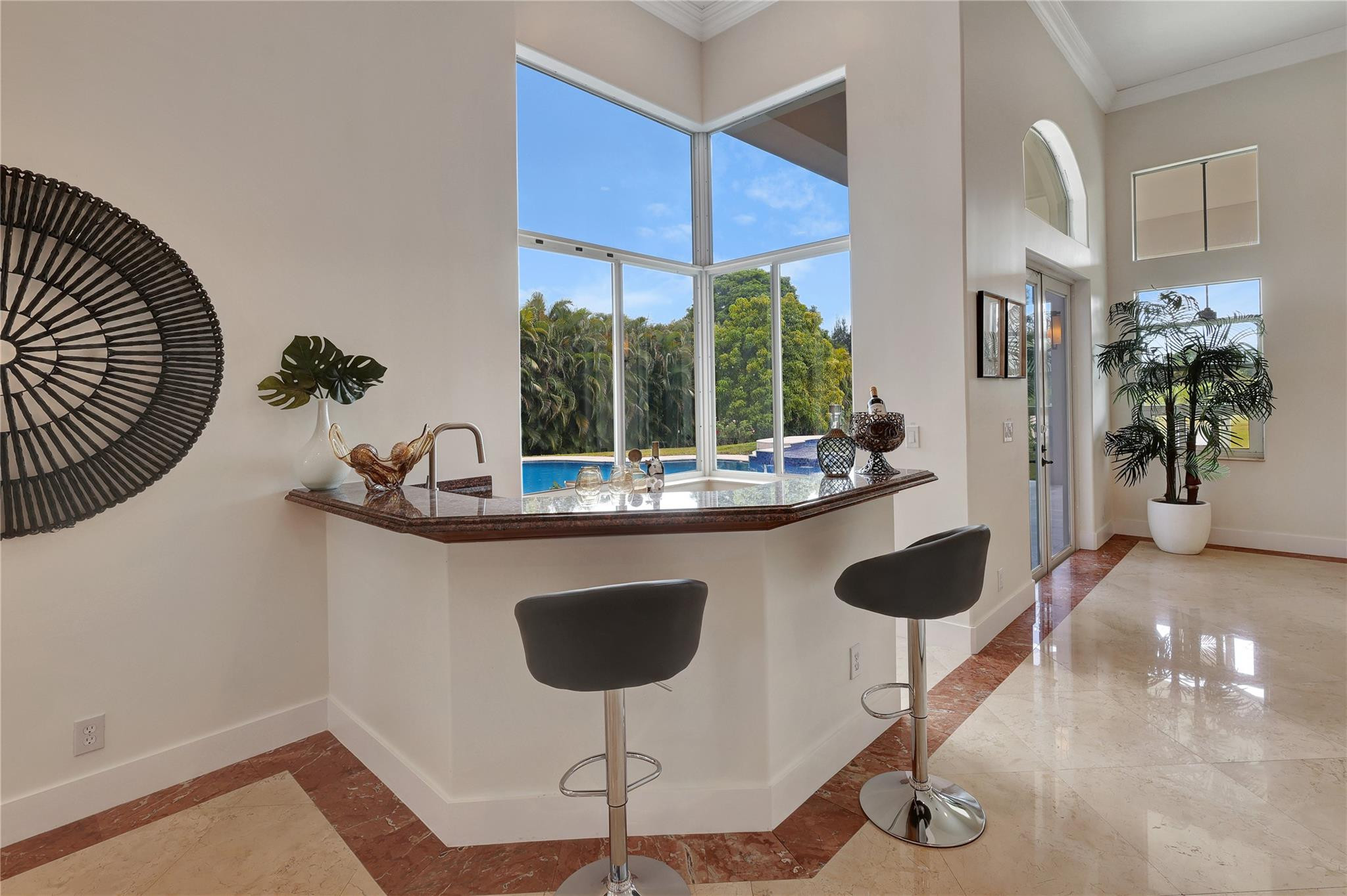Undisclosed Address Southwest Ranches, FL 33332 - Photo 22 of 54 a kitchen with a table and chairs