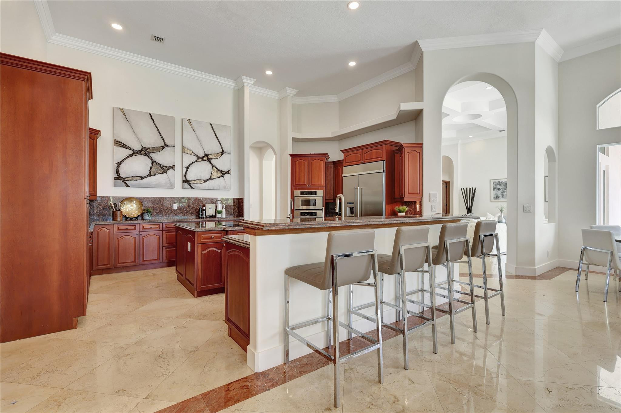 Undisclosed Address Southwest Ranches, FL 33332 - Photo 27 of 54 a kitchen with stainless steel appliances granite countertop a stove a sink and a dining table