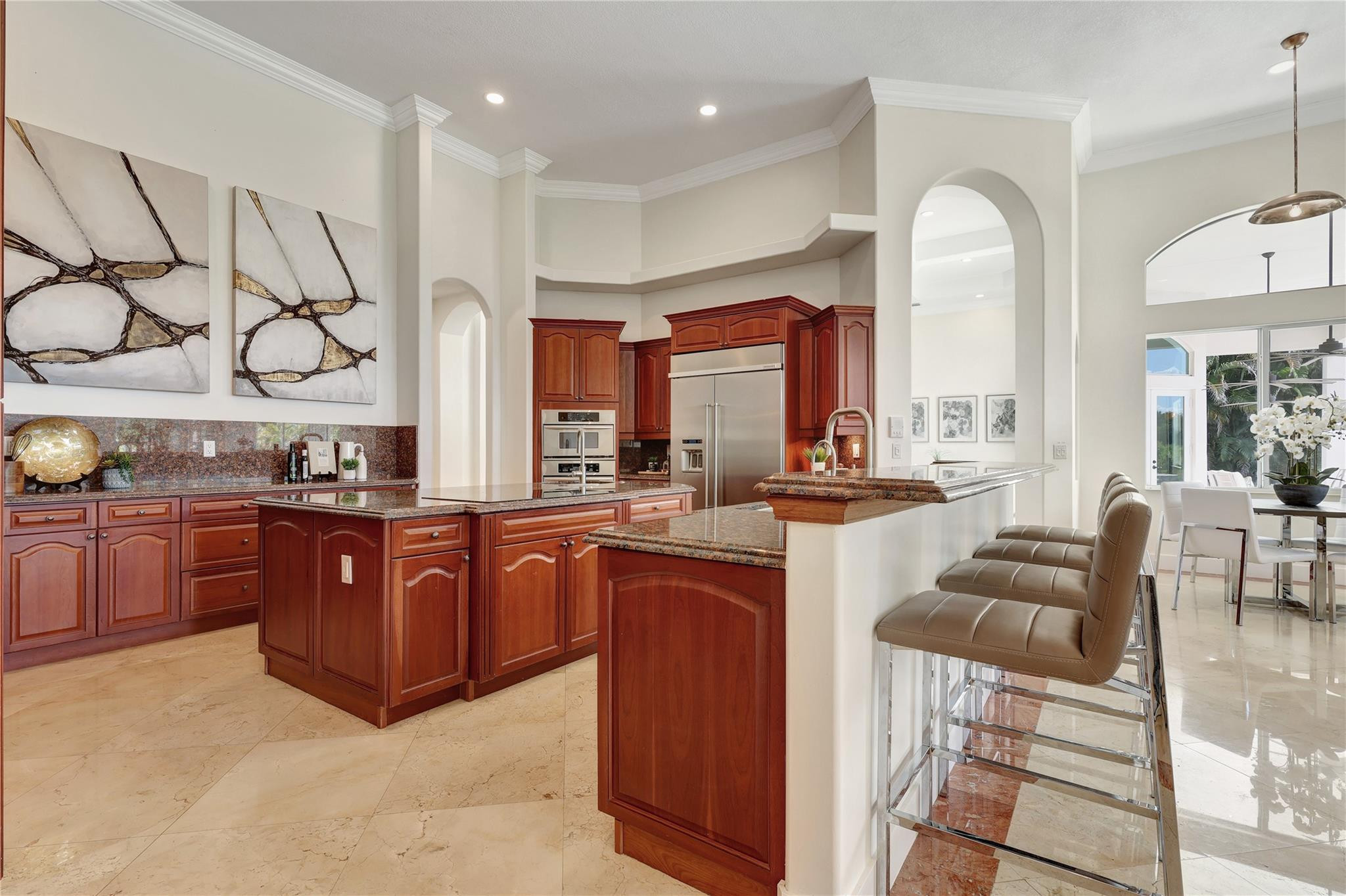 Undisclosed Address Southwest Ranches, FL 33332 - Photo 28 of 54 a large kitchen with stainless steel appliances granite countertop a stove and cabinets