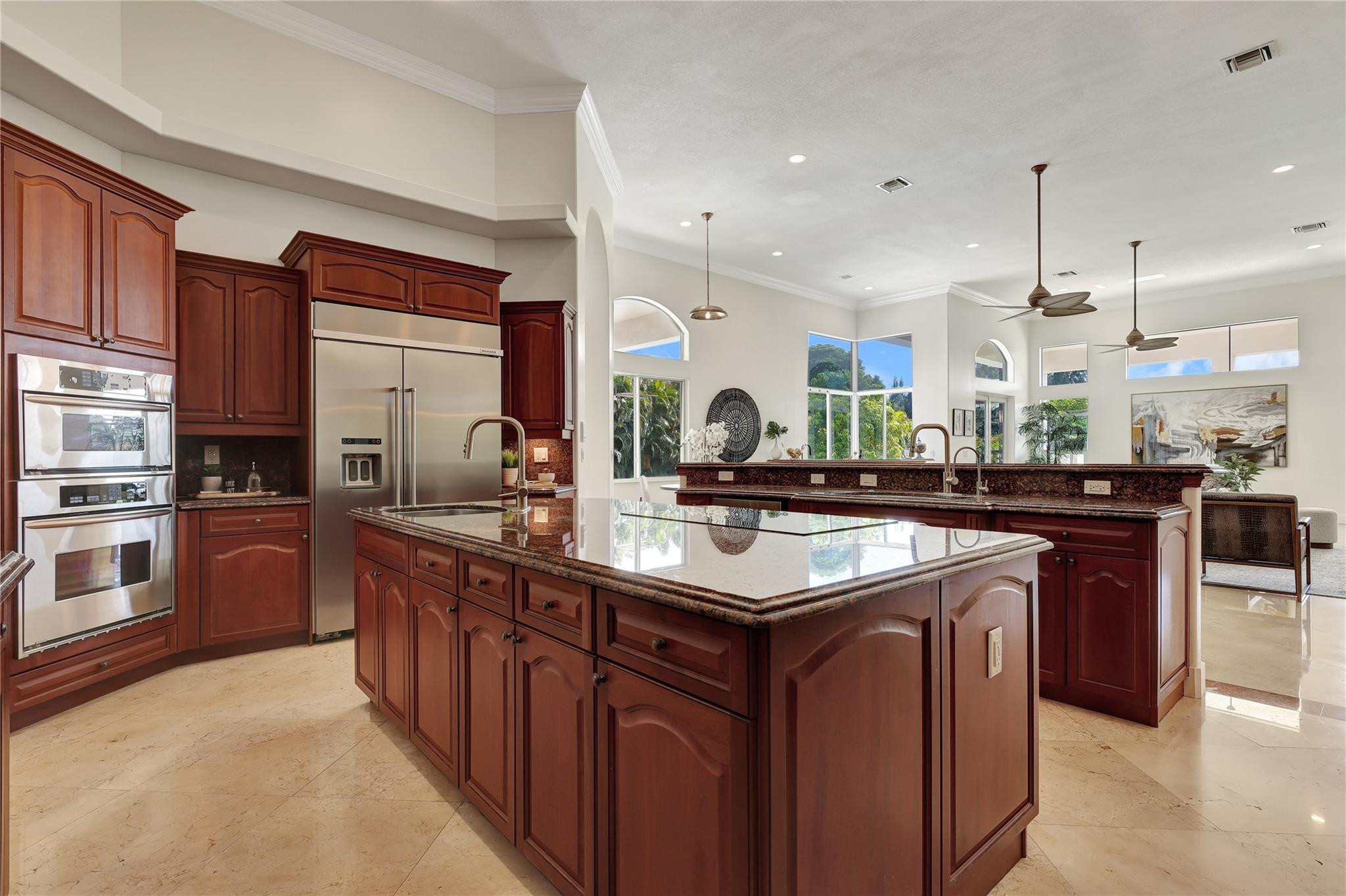 Undisclosed Address Southwest Ranches, FL 33332 - Photo 29 of 54 a kitchen with stainless steel appliances granite countertop a sink a stove and a refrigerator