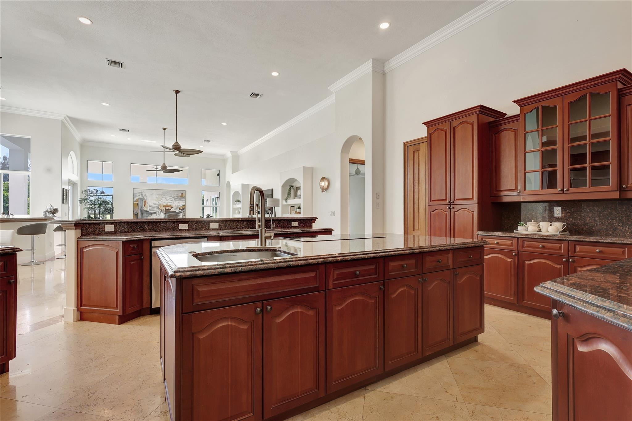 Undisclosed Address Southwest Ranches, FL 33332 - Photo 30 of 54 a kitchen with stainless steel appliances granite countertop wooden cabinets a stove a sink and a granite counter tops