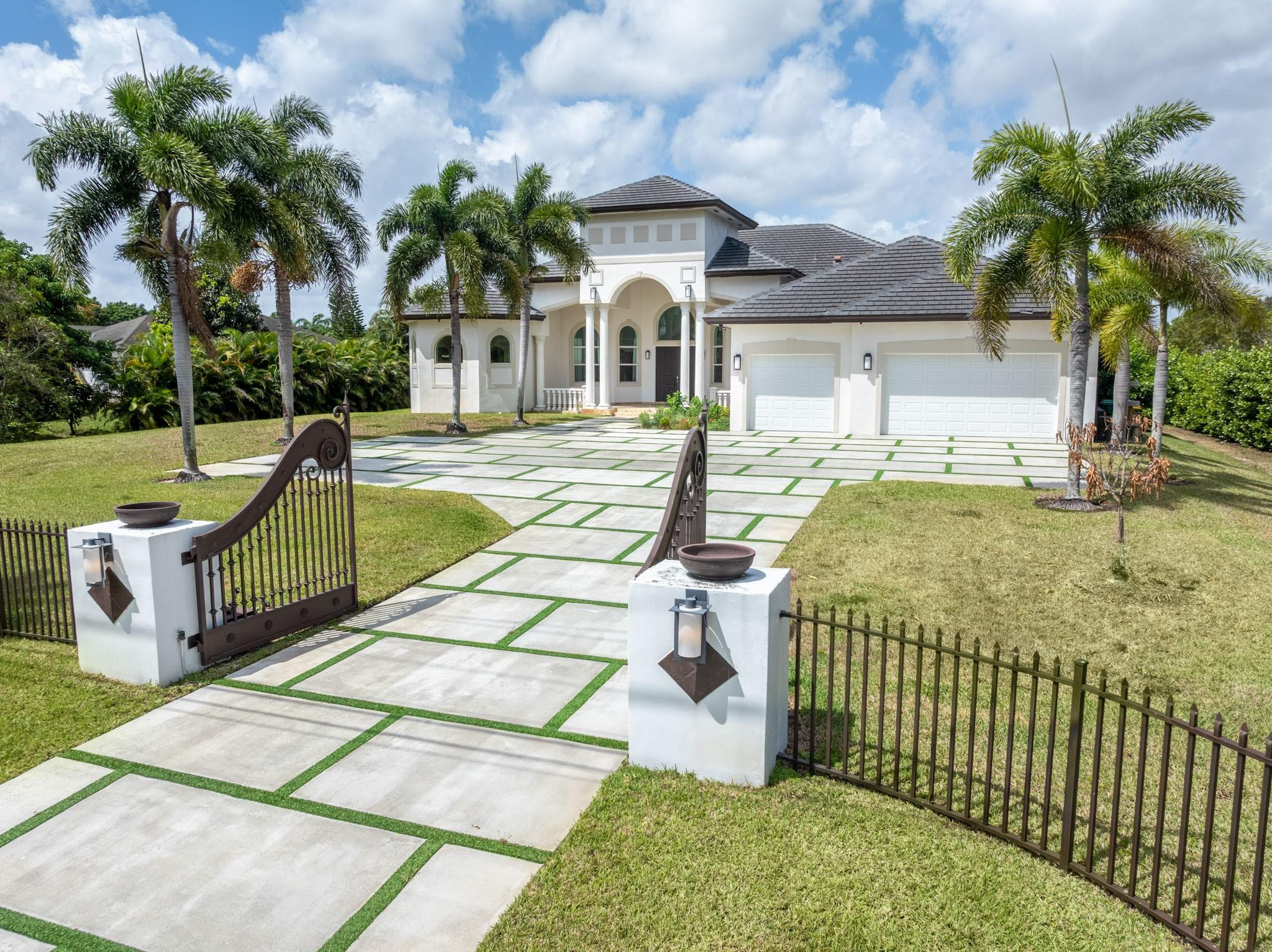 Undisclosed Address Southwest Ranches, FL 33332 - Photo 3 of 54 a front view of a house with swimming pool having outdoor seating