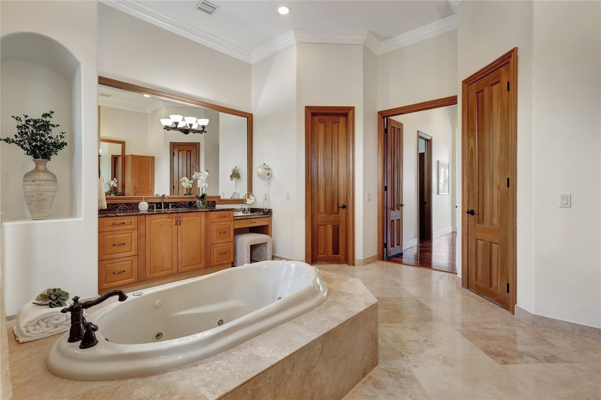 Undisclosed Address Southwest Ranches, FL 33332 - Photo 37 of 54 a bathroom with a tub sink and mirror