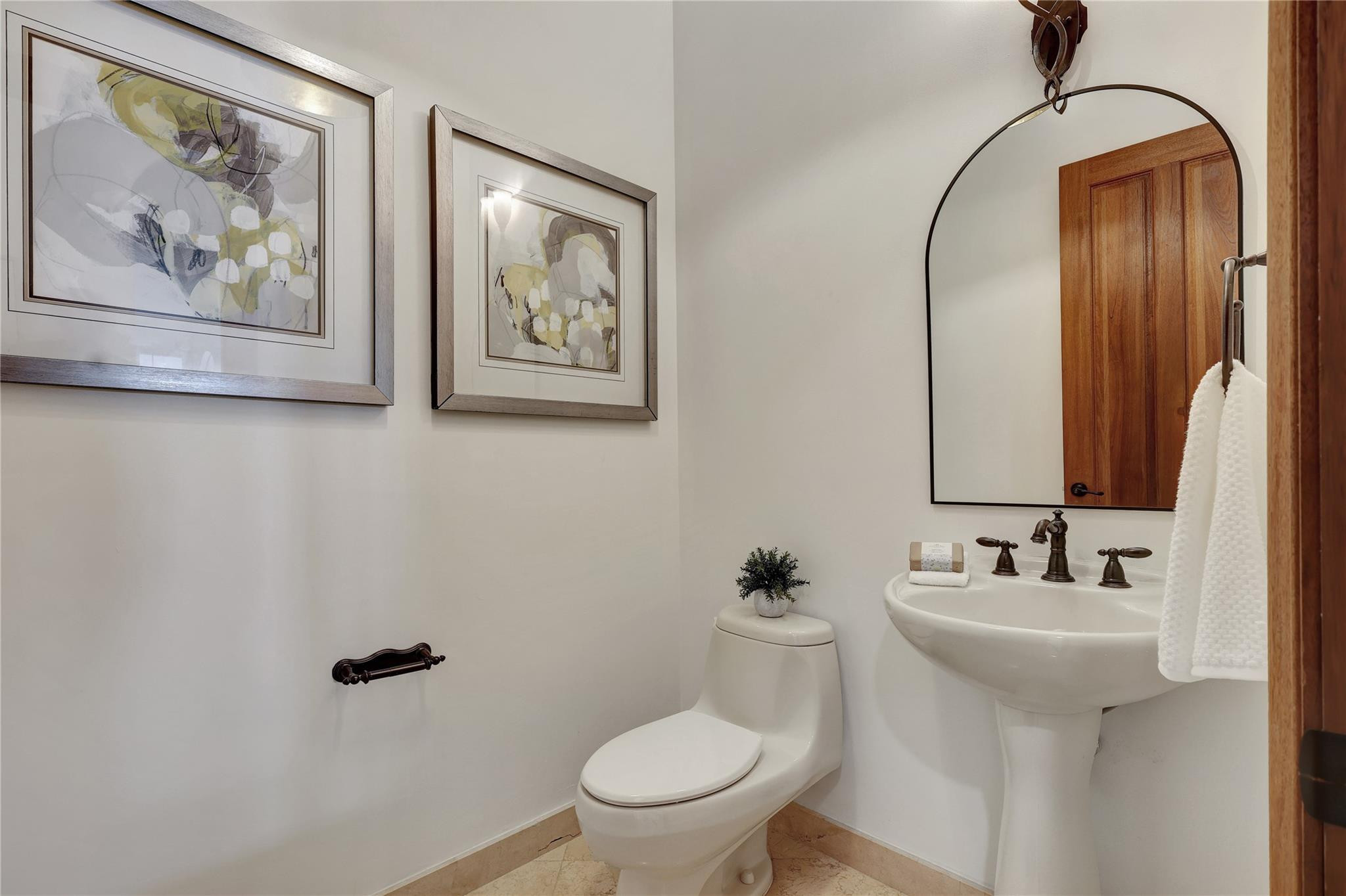 Undisclosed Address Southwest Ranches, FL 33332 - Photo 39 of 54 a bathroom with a toilet a sink and mirror