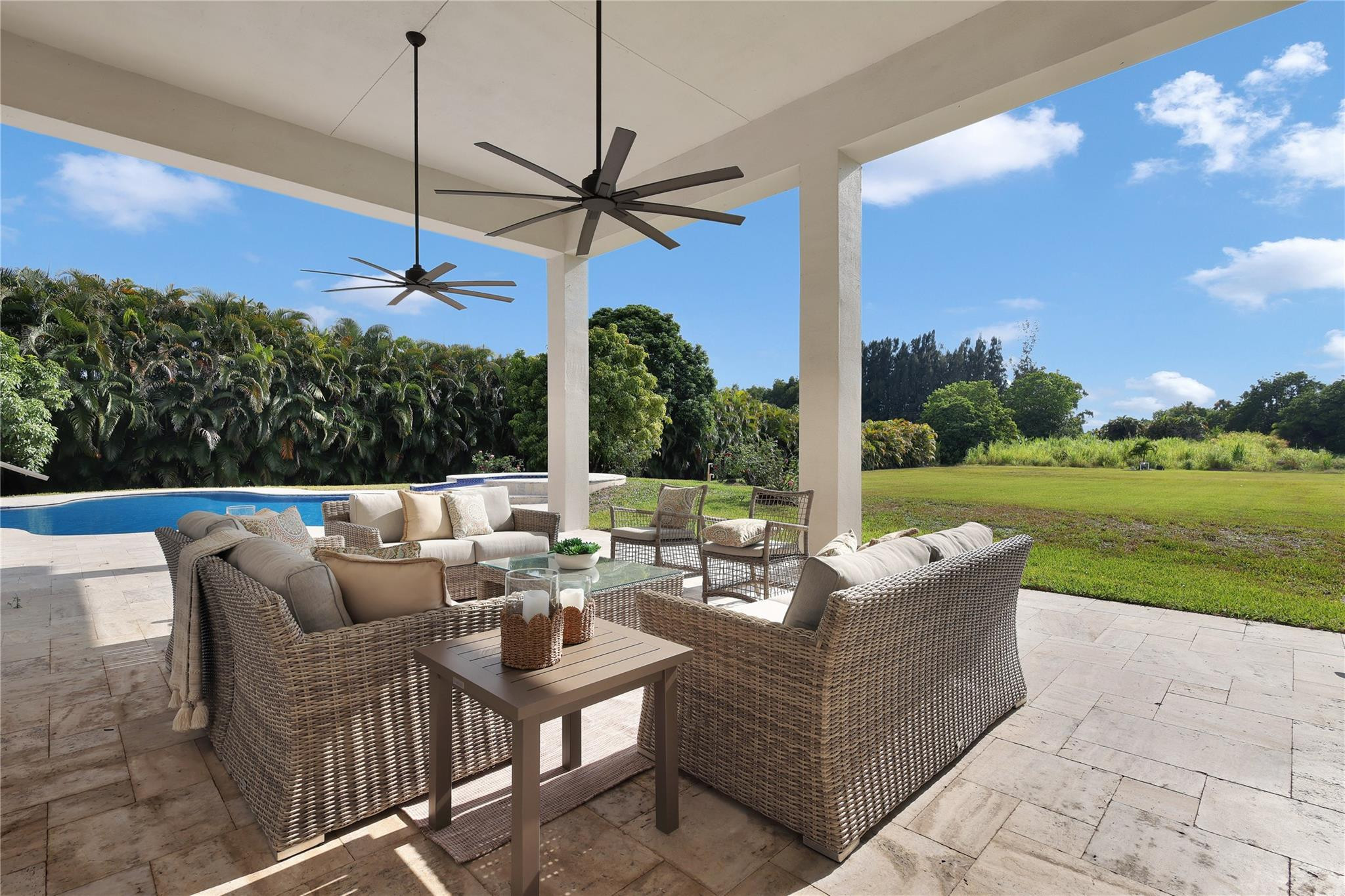 Undisclosed Address Southwest Ranches, FL 33332 - Photo 42 of 54 a view of a patio with couches and chairs