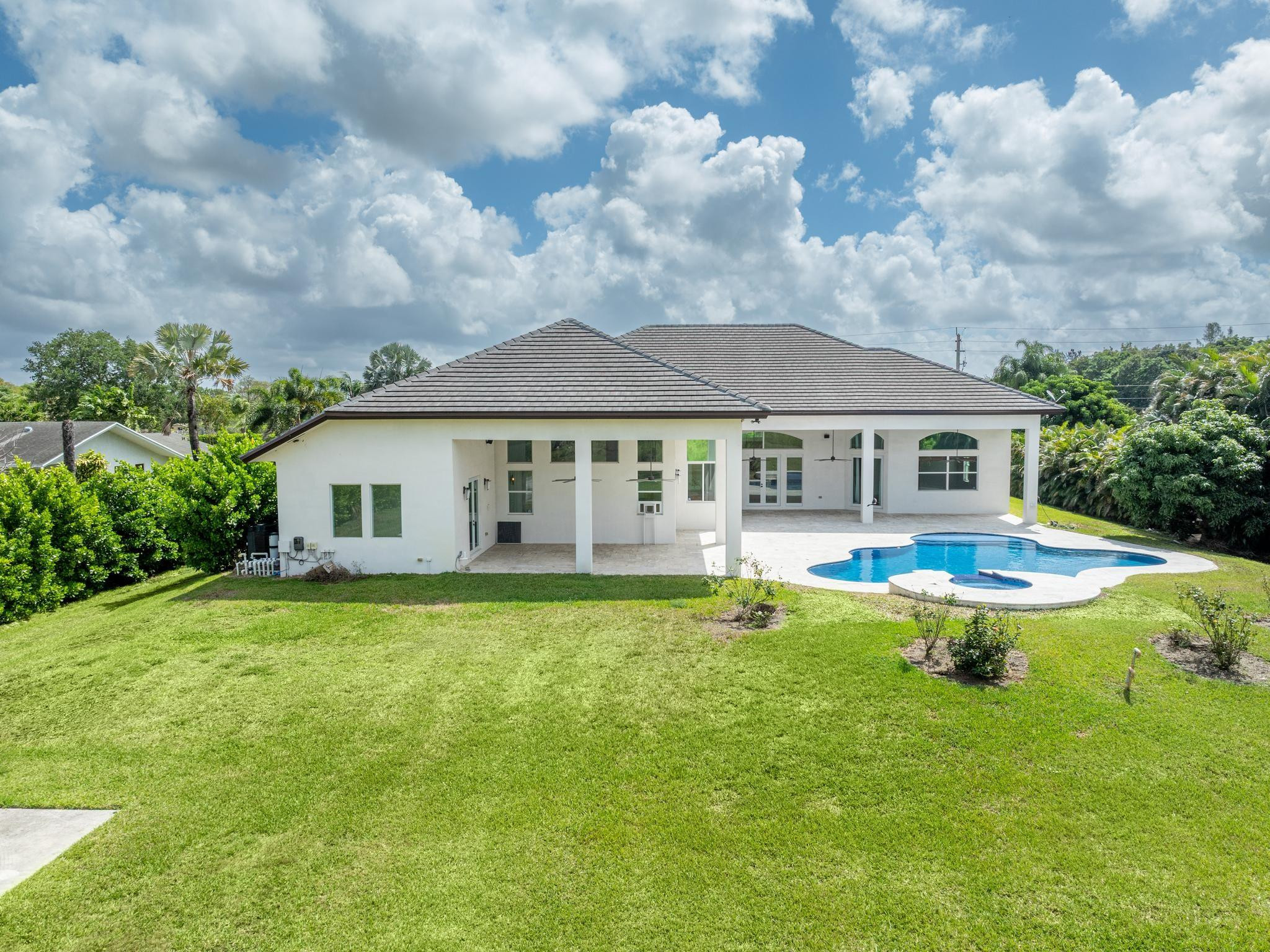 Undisclosed Address Southwest Ranches, FL 33332 - Photo 48 of 54 a swimming pool with outdoor seating and yard