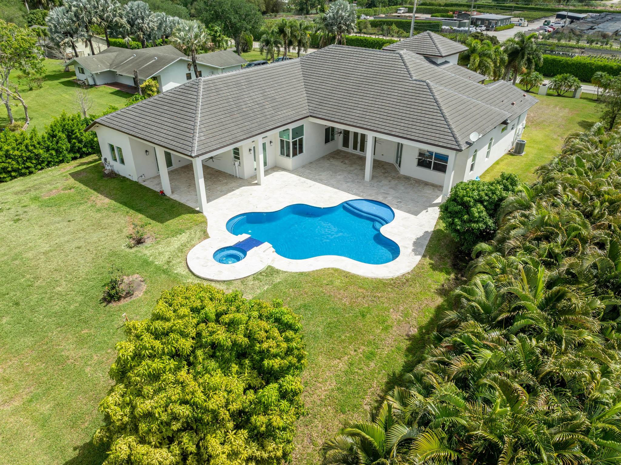 Undisclosed Address Southwest Ranches, FL 33332 - Photo 5 of 54 an aerial view of a house