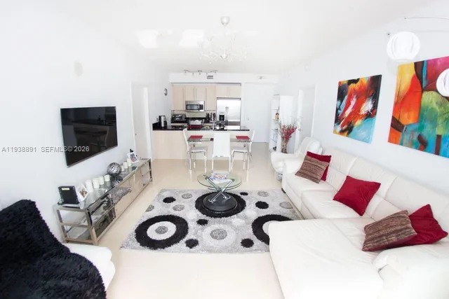 a living room with furniture and a flat screen tv