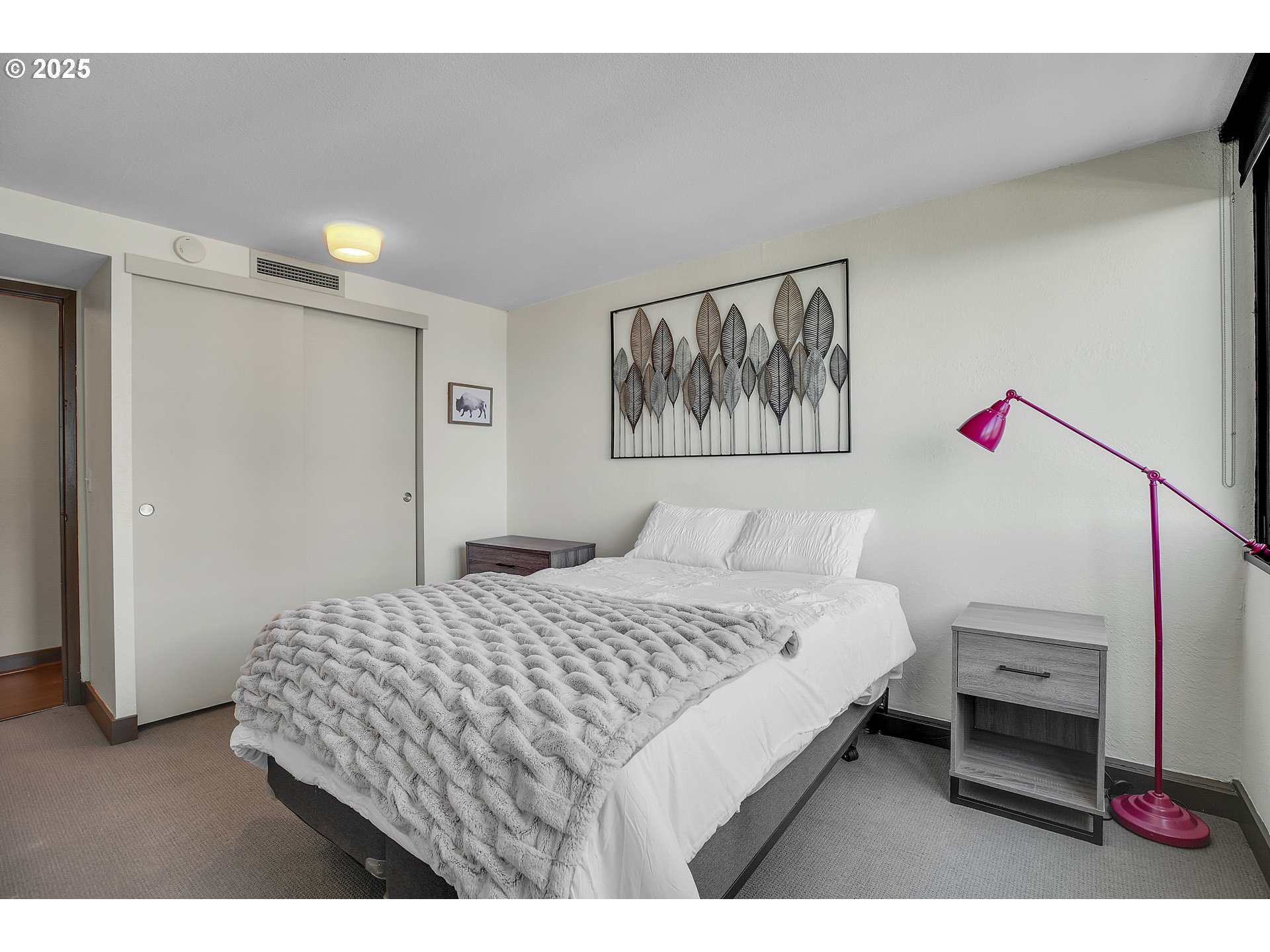 255 Southwest Harrison Street, Unit 17F Portland, OR 97201 - Photo 16 of 31 a bedroom with a bed and a view of bathroom