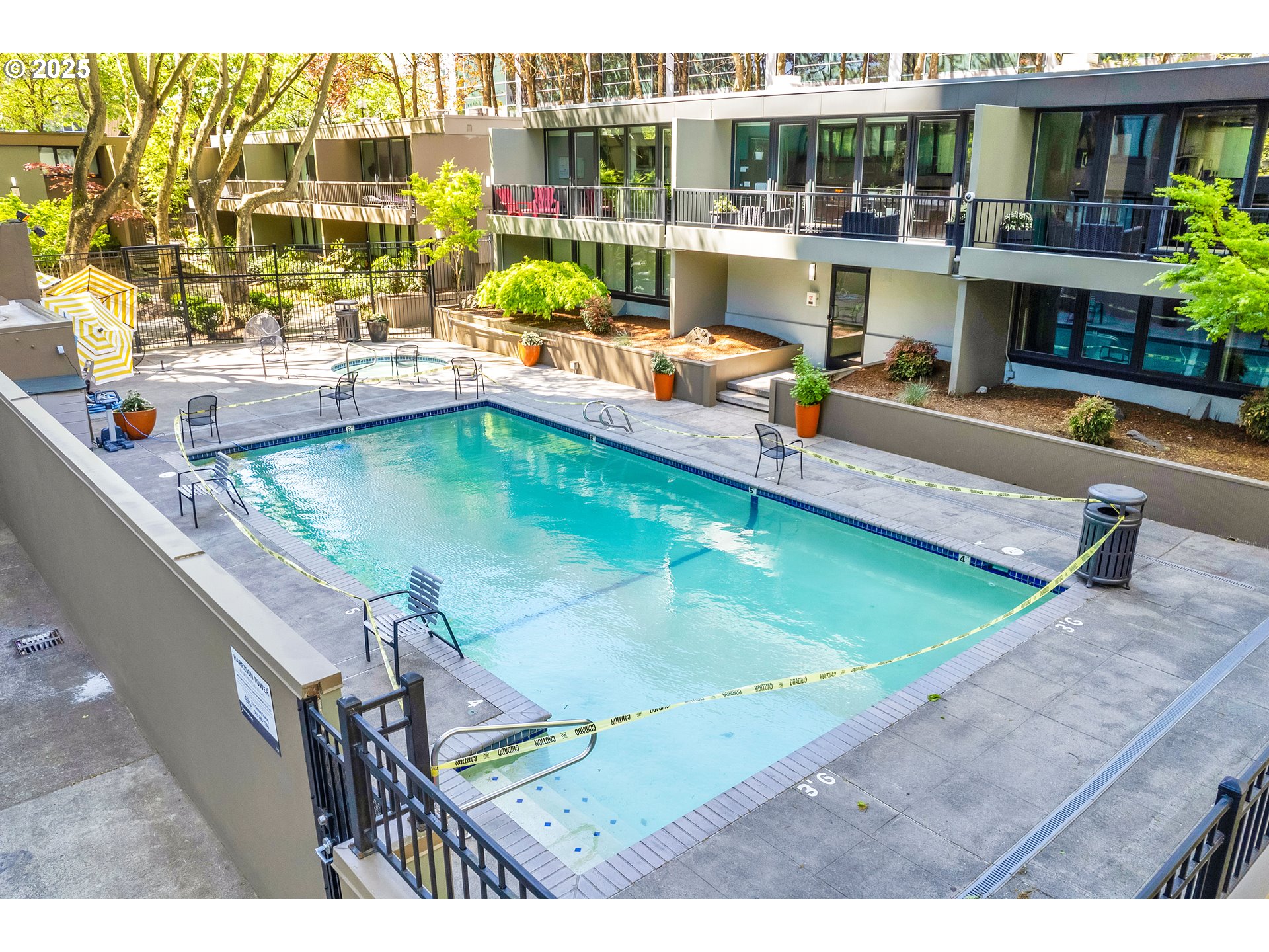 255 Southwest Harrison Street, Unit 17F Portland, OR 97201 - Photo 25 of 31 a view of a swimming pool with outdoor seating