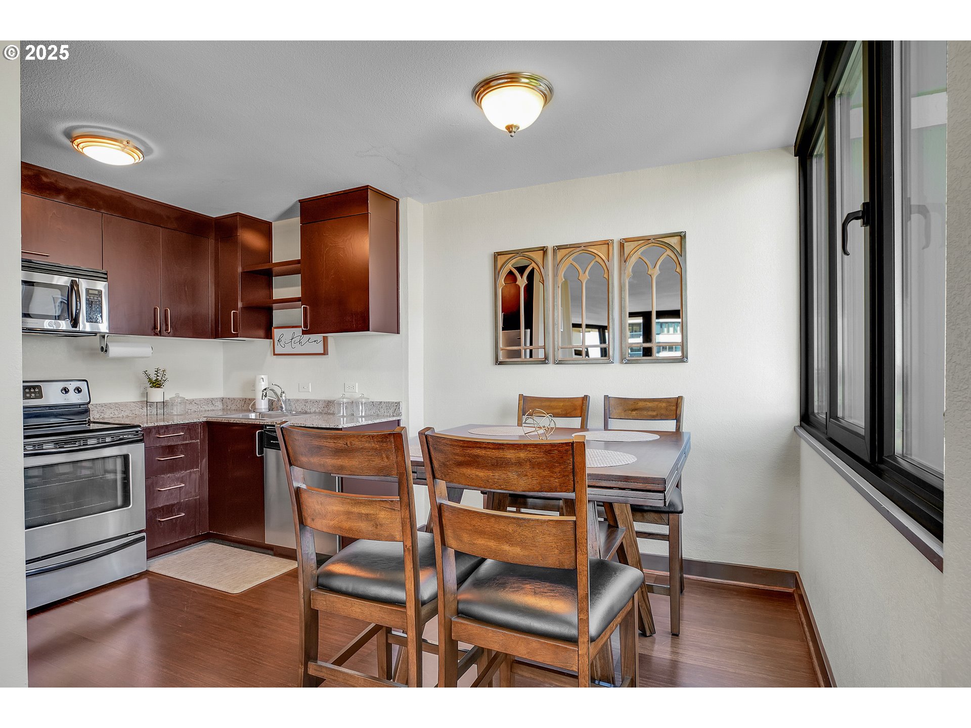 255 Southwest Harrison Street, Unit 17F Portland, OR 97201 - Photo 6 of 31 a kitchen with a refrigerator and a stove top oven
