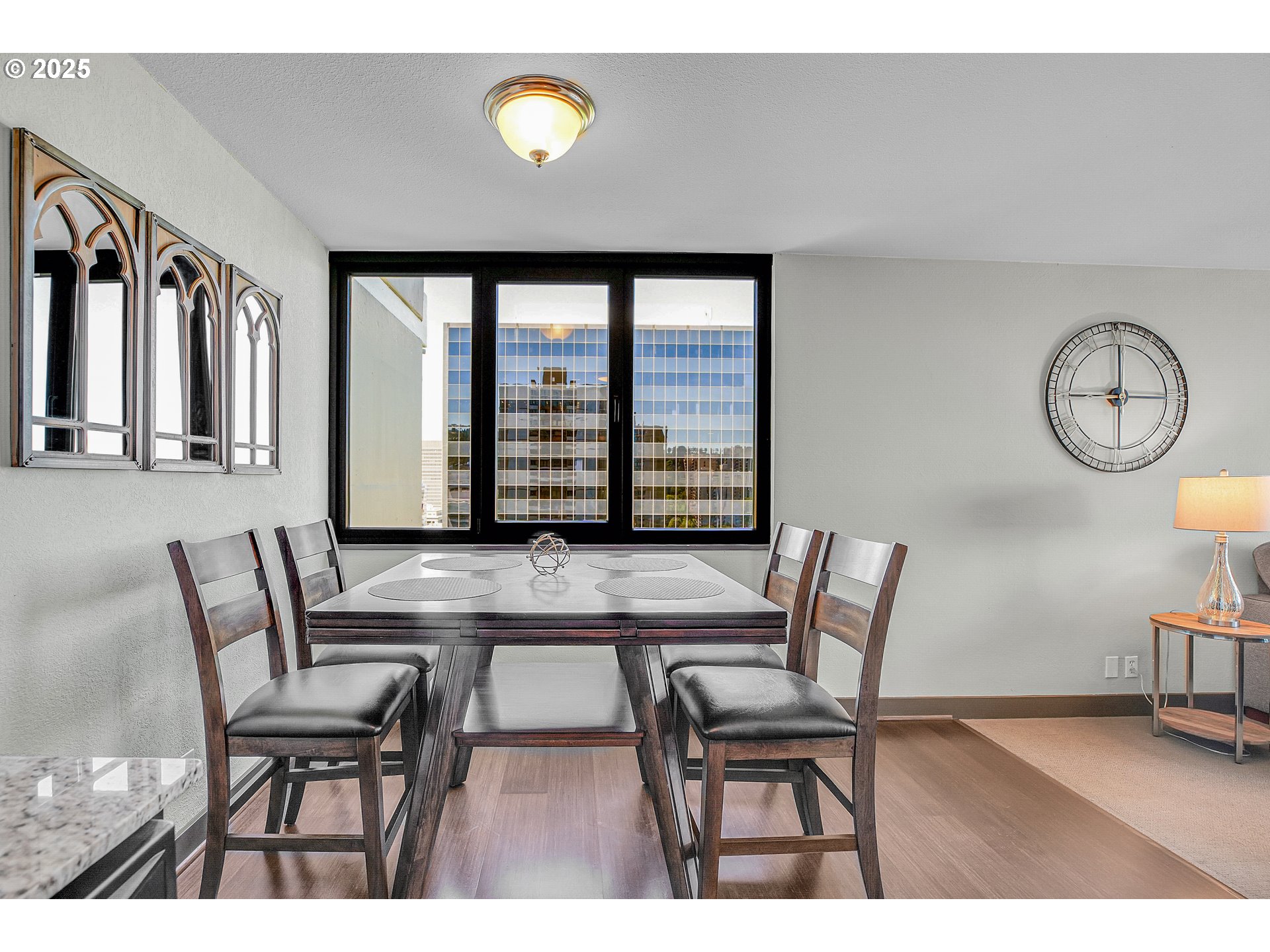 255 Southwest Harrison Street, Unit 17F Portland, OR 97201 - Photo 8 of 31 a view of a livingroom with furniture and a chair