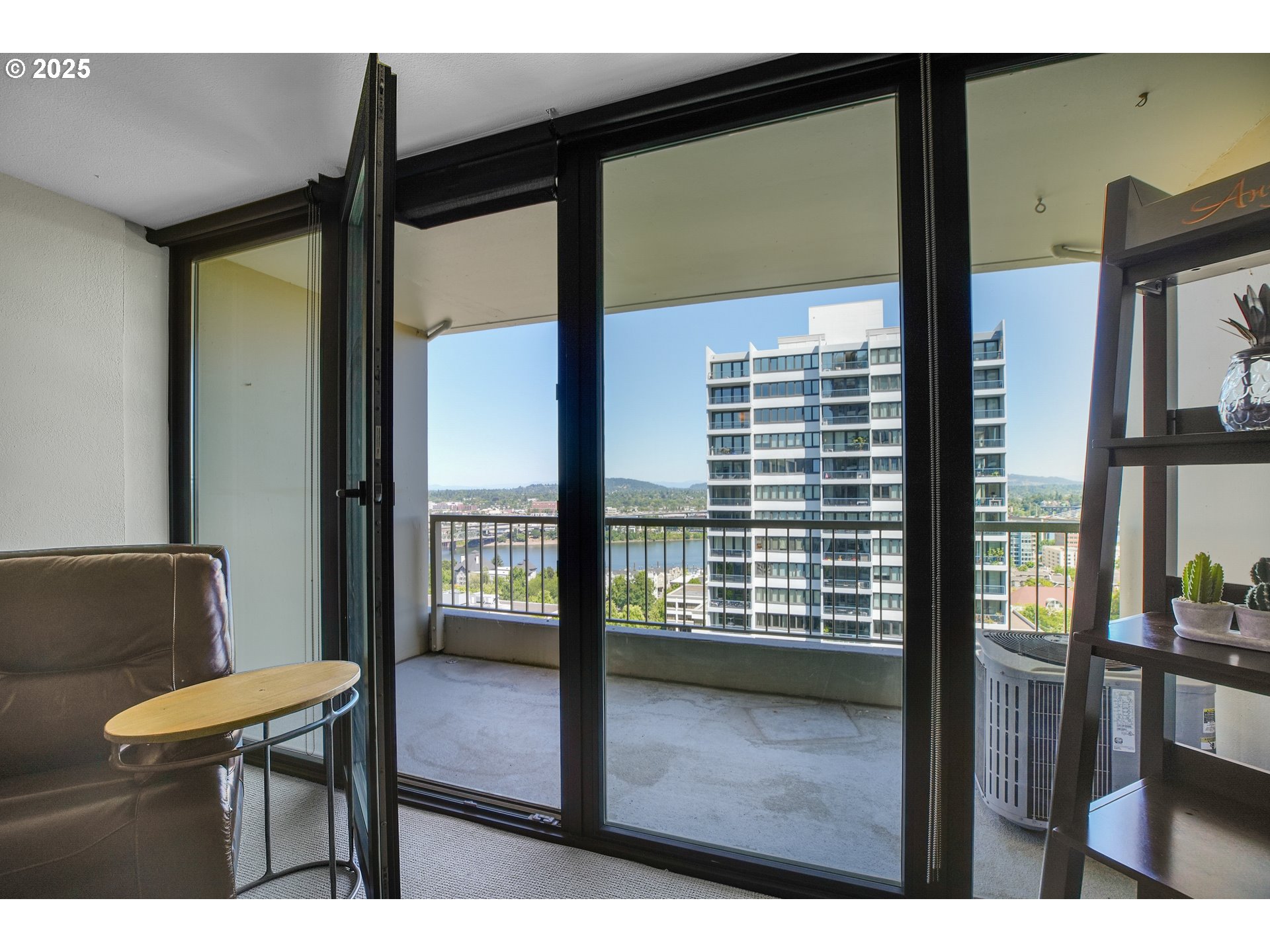 255 Southwest Harrison Street, Unit 17F Portland, OR 97201 - Photo 10 of 31 a view of a room with furniture and a window