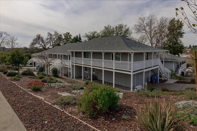 a front view of a house with garden