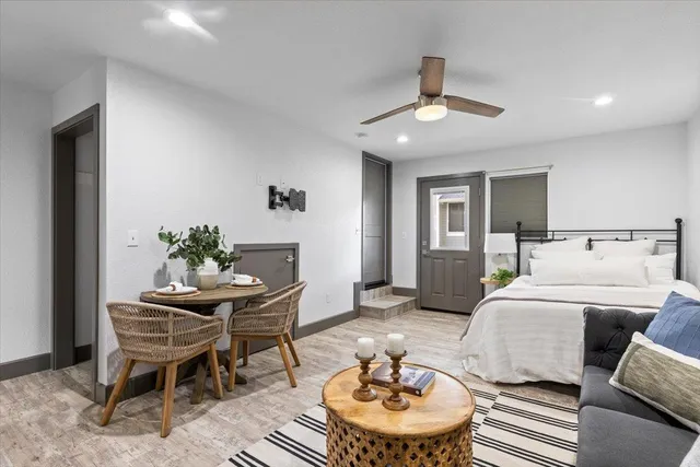 a living room with furniture and a lamp