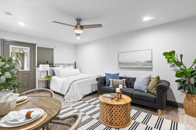 a bedroom with a bed and a couch