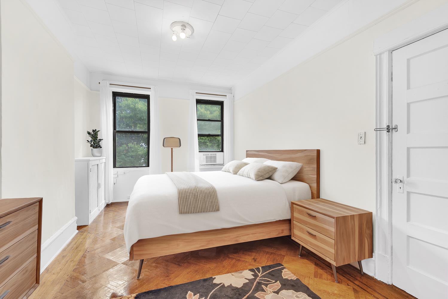 a bedroom with a bed and window