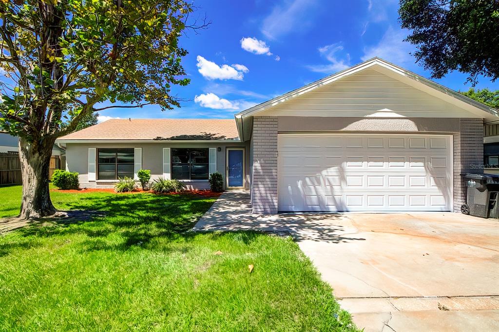 17816 Fallowfield Drive Lutz, FL 33549 - Photo 1 of 38 a front view of a house with a yard and porch