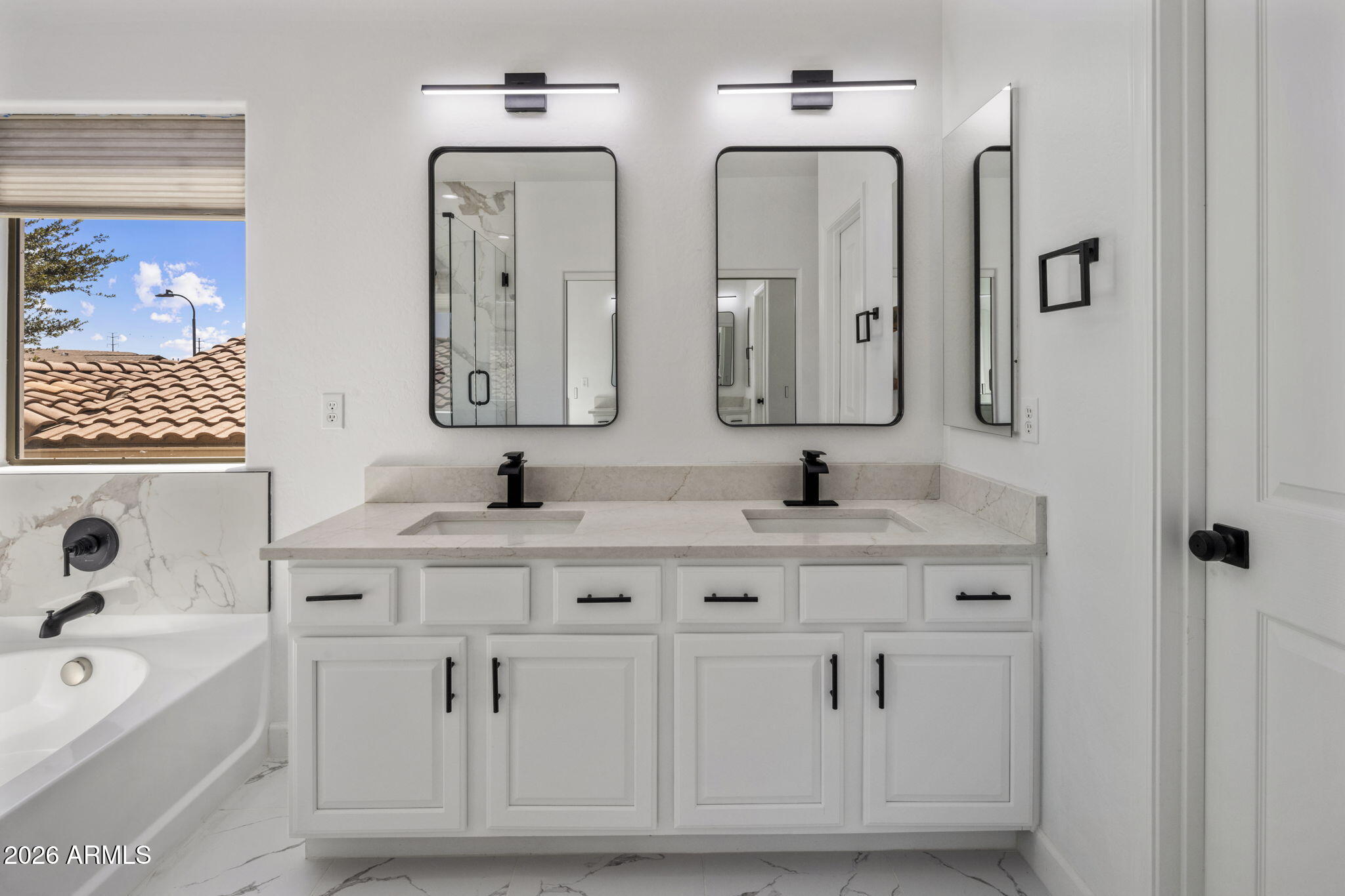 5121 West Beverly Road Laveen, AZ 85339 - Photo 2 of 32 a spacious bathroom with double vanity sinks a mirror and a bathtub