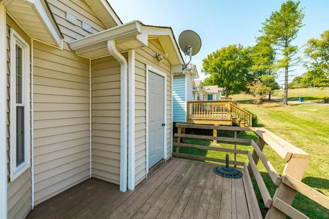 a view of a chair and tables in the balcony