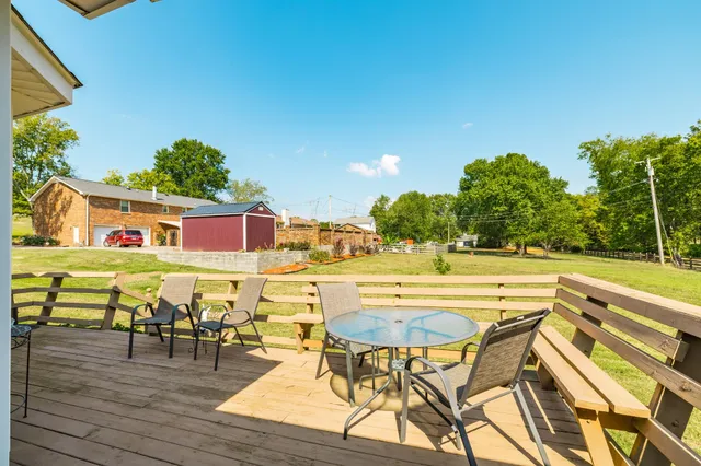a view of a house with swimming pool in front of it
