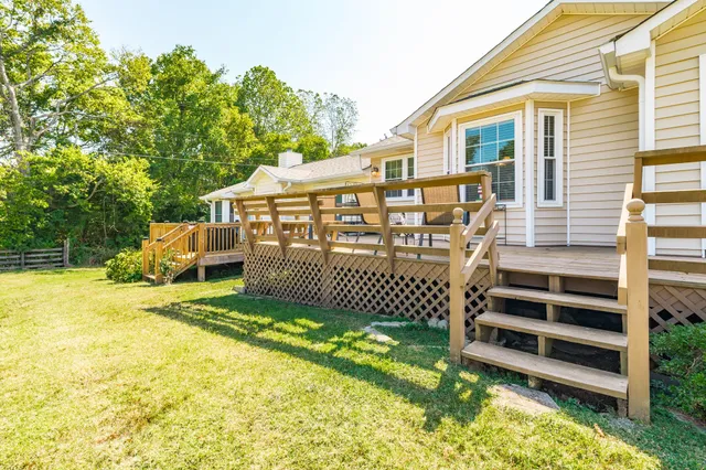 a view of a room with furniture and window