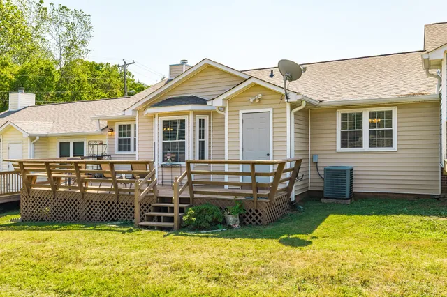 a view of a workspace with furniture and a workspace