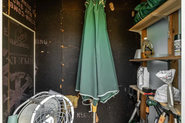 a dining room with furniture a chandelier and window