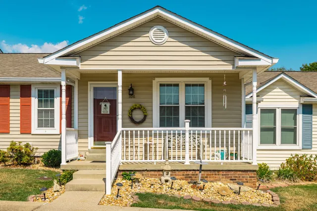 front view of a house with a yard