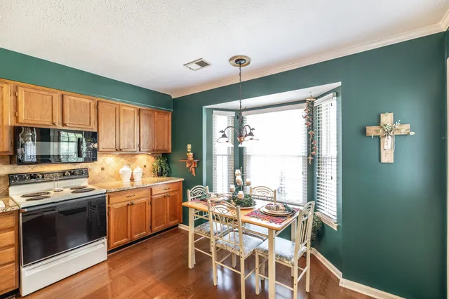a view of a lake with a house in the background