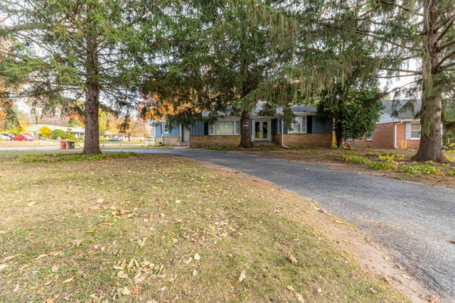 a view of a trees in front of a house