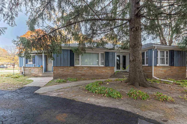 front view of a house with a yard