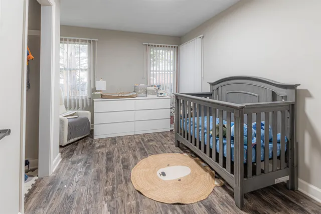 a bedroom with furniture and a window