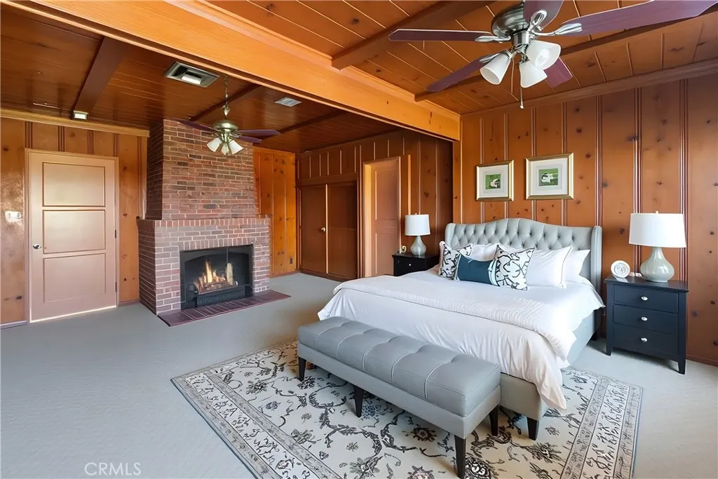 15207 Greenleaf Street Sherman Oaks, CA 91403 - Photo 15 of 32 a bedroom with a bed and a fireplace