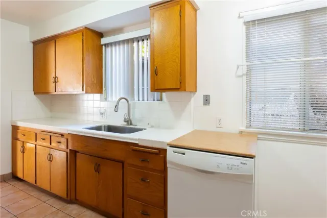 a kitchen with a sink and a window