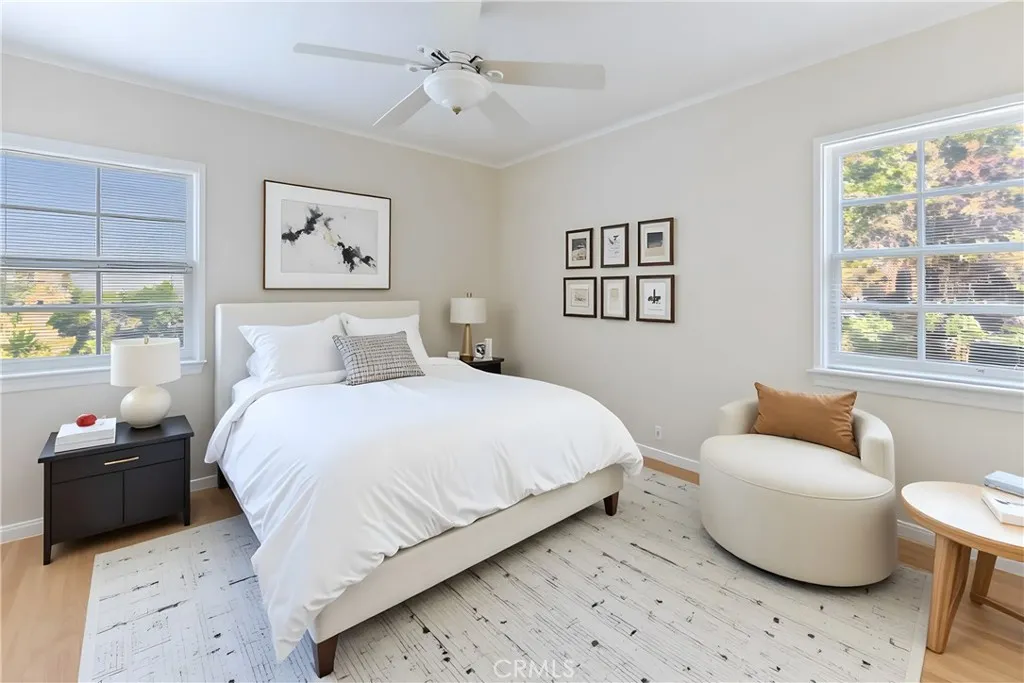 15207 Greenleaf Street Sherman Oaks, CA 91403 - Photo 25 of 32 a bedroom with a bed and wooden floor