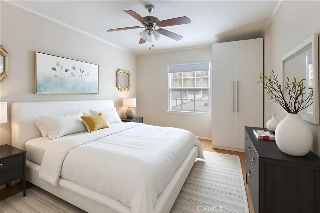 15207 Greenleaf Street Sherman Oaks, CA 91403 - Photo 27 of 32 a bedroom with a large bed and a chandelier