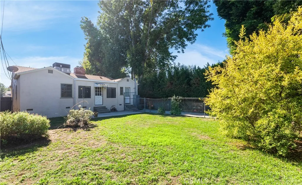 15207 Greenleaf Street Sherman Oaks, CA 91403 - Photo 32 of 32 a house with swimming pool in front