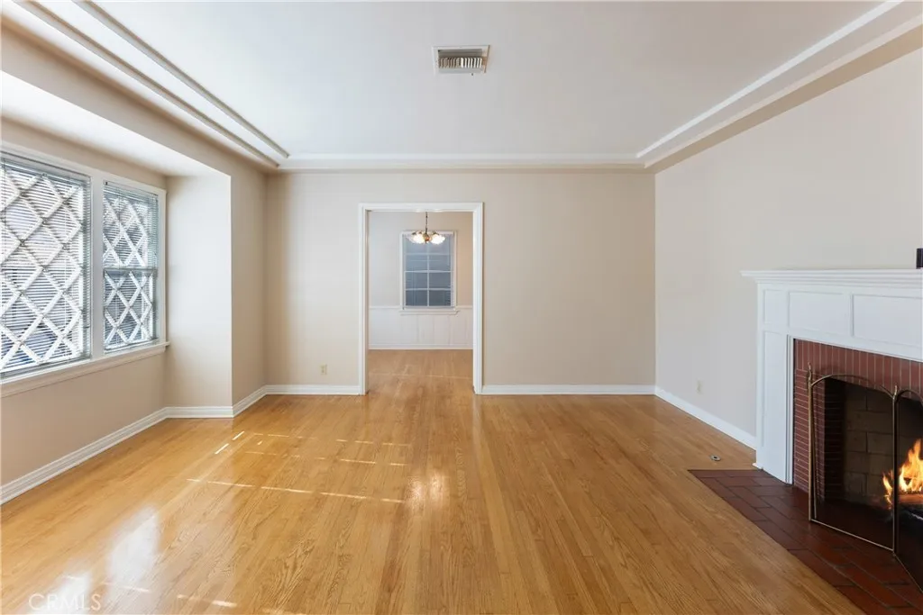 15207 Greenleaf Street Sherman Oaks, CA 91403 - Photo 5 of 32 a view of an empty room with wooden floor and a window