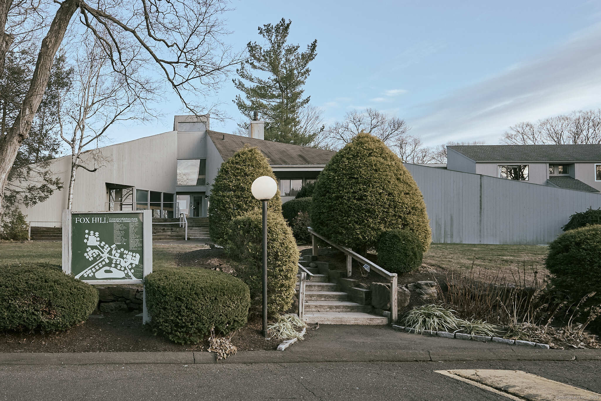 7 Elderberry Lane, Unit 7 Ridgefield, CT 06877 - Photo 21 of 26 a front view of a house