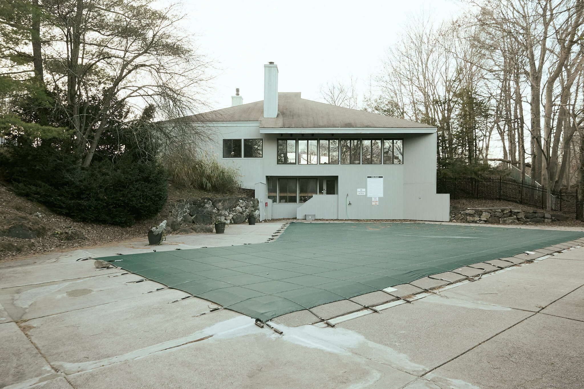 7 Elderberry Lane, Unit 7 Ridgefield, CT 06877 - Photo 23 of 26 a front view of a house with a yard
