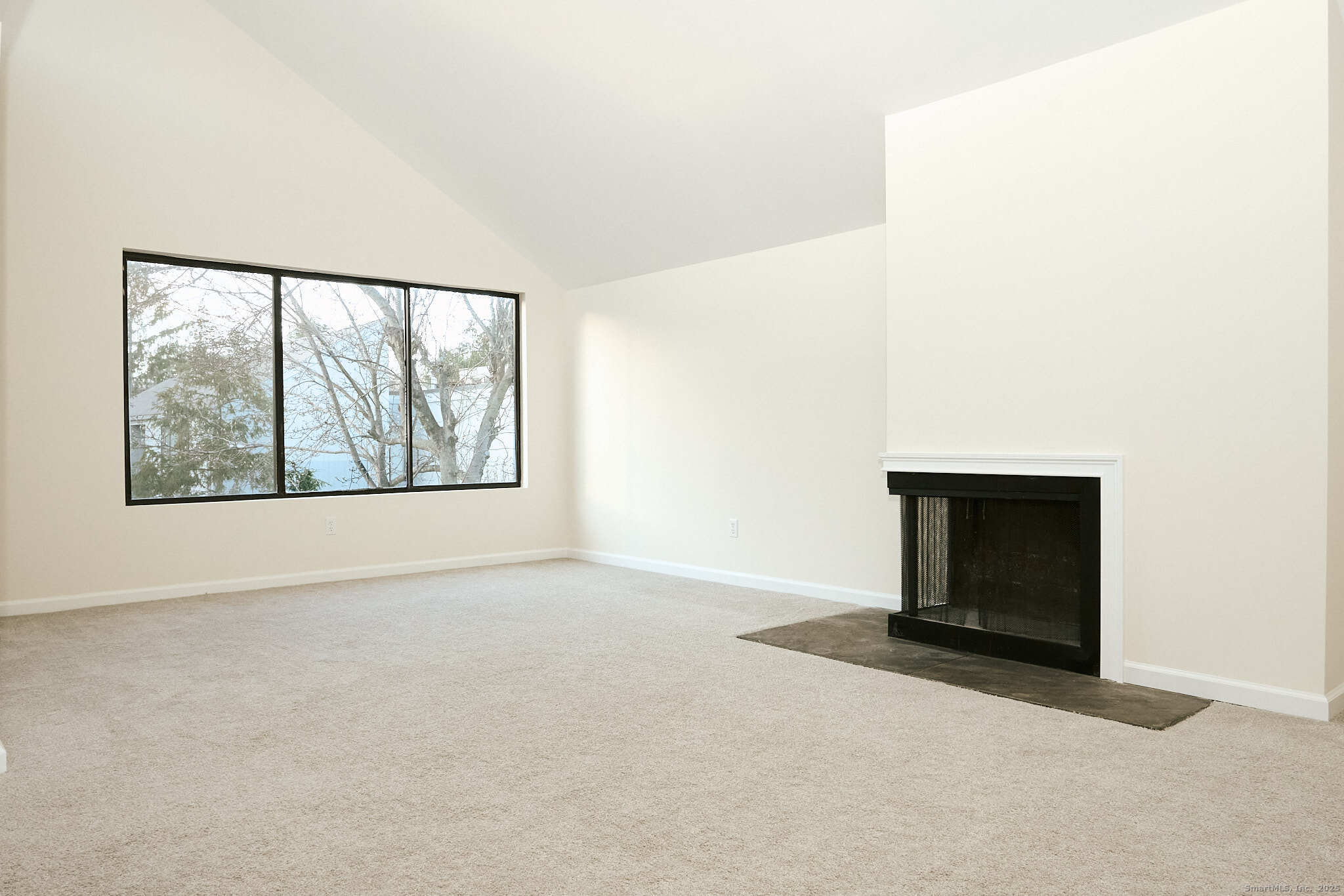 7 Elderberry Lane, Unit 7 Ridgefield, CT 06877 - Photo 3 of 26 an empty room with windows