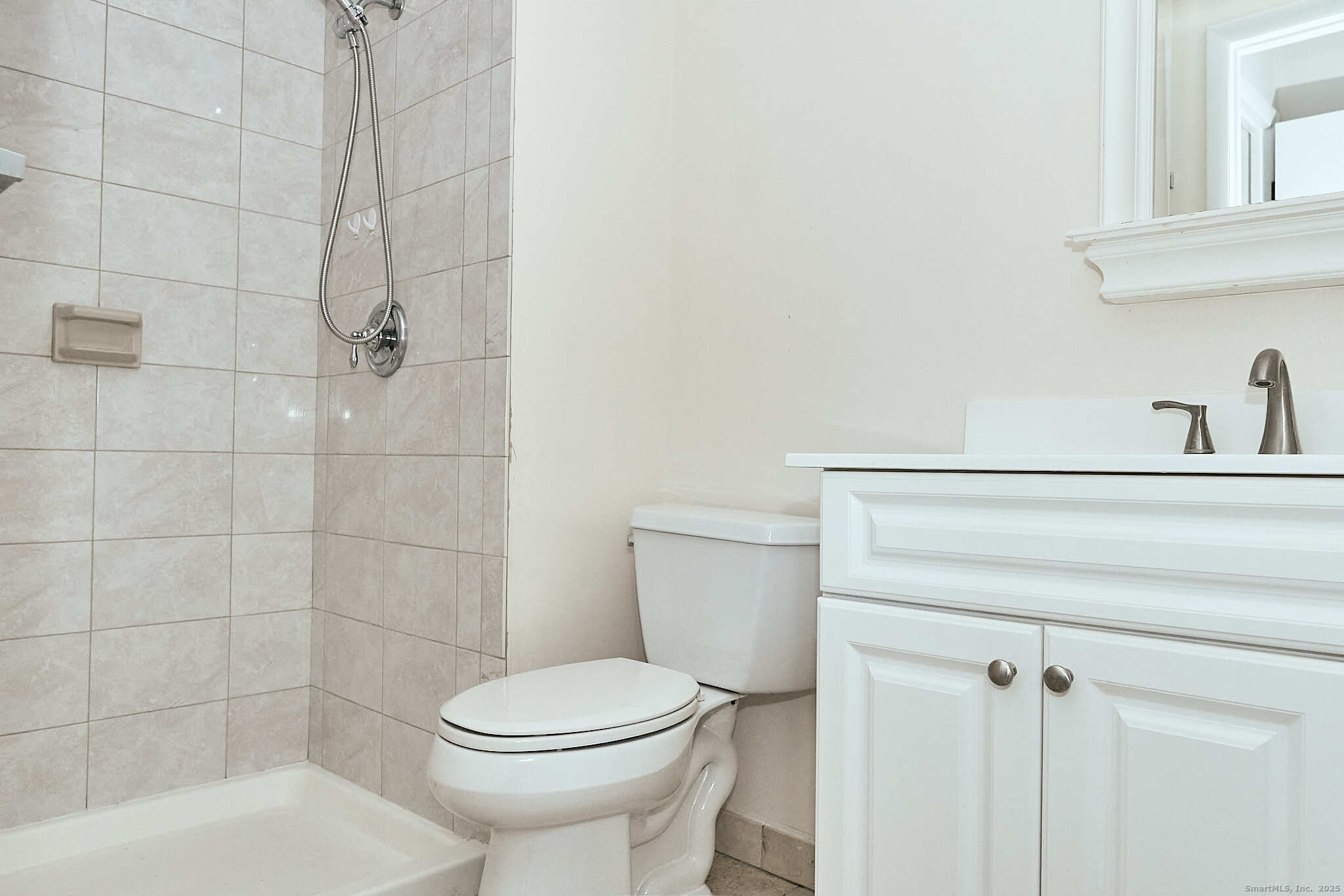 7 Elderberry Lane, Unit 7 Ridgefield, CT 06877 - Photo 7 of 26 a bathroom with a toilet and shower