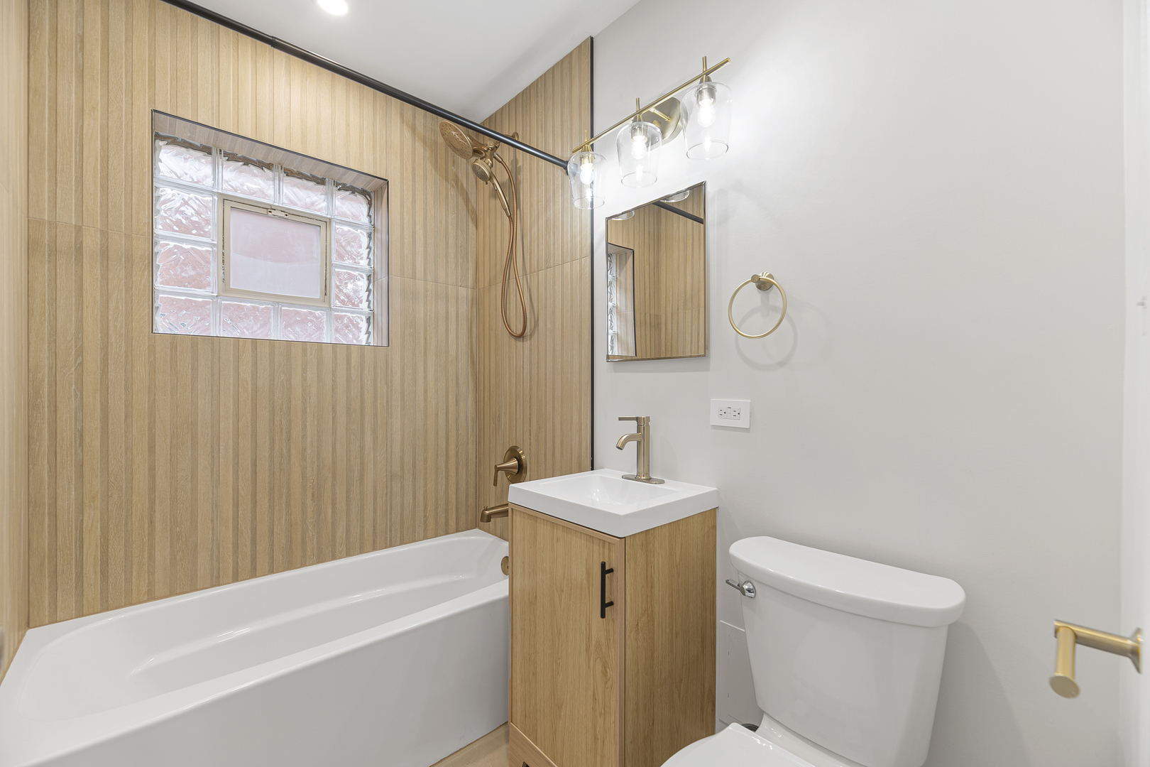 132 Ridge Avenue, Unit 2 Evanston, IL 60202 - Photo 10 of 14 a bathroom with a sink a toilet and shower