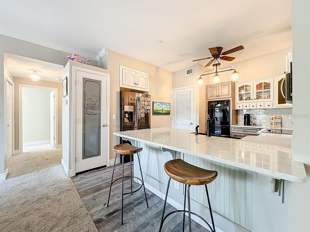 793 Celebration Avenue Celebration, FL 34747 - Photo 11 of 32 a kitchen with a table and chairs in it