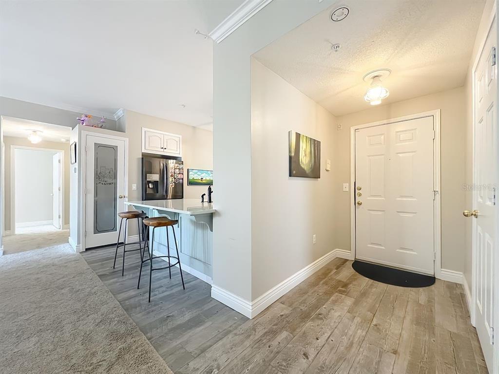 793 Celebration Avenue Celebration, FL 34747 - Photo 4 of 32 a view of kitchen with furniture and a refrigerator